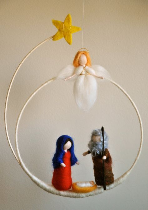 an ornament hanging from the ceiling with two figurines