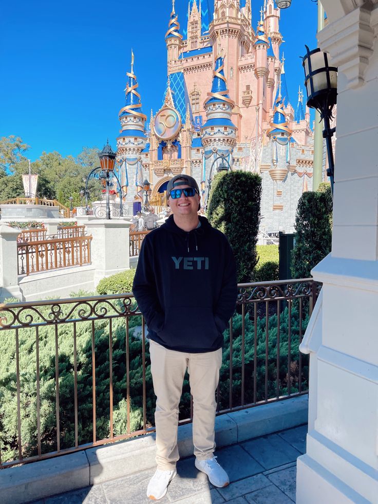 a man standing in front of a castle