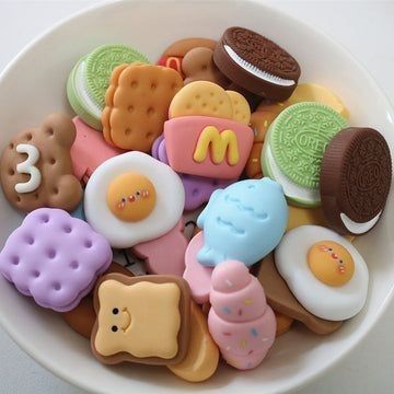 a bowl filled with lots of different types of cookies