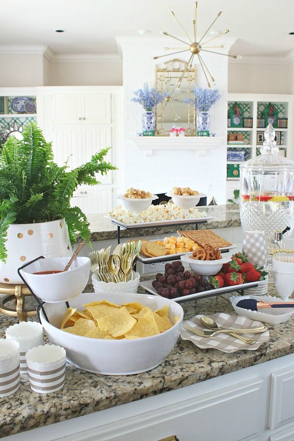 a table filled with food and drinks on top of a counter