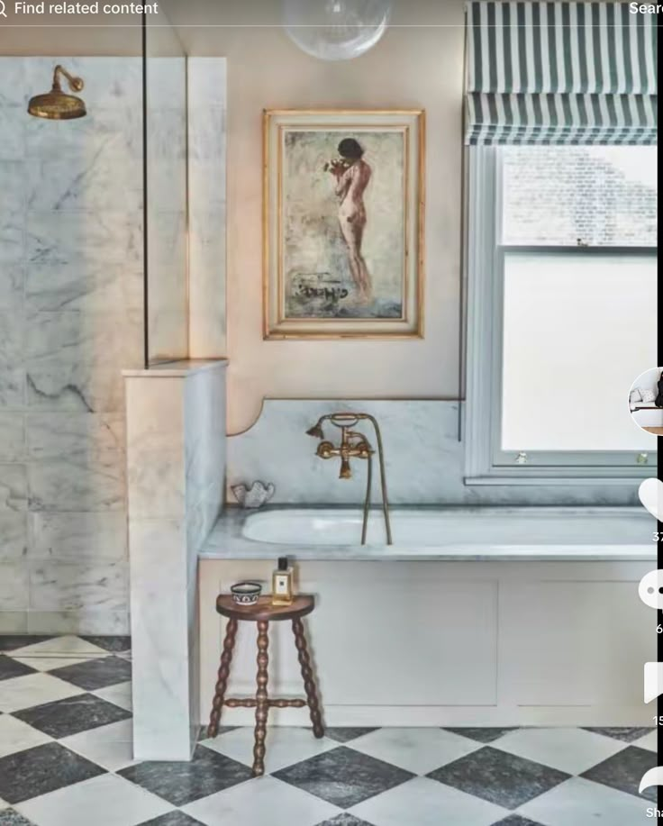 a bathroom with a checkered floor and marble walls