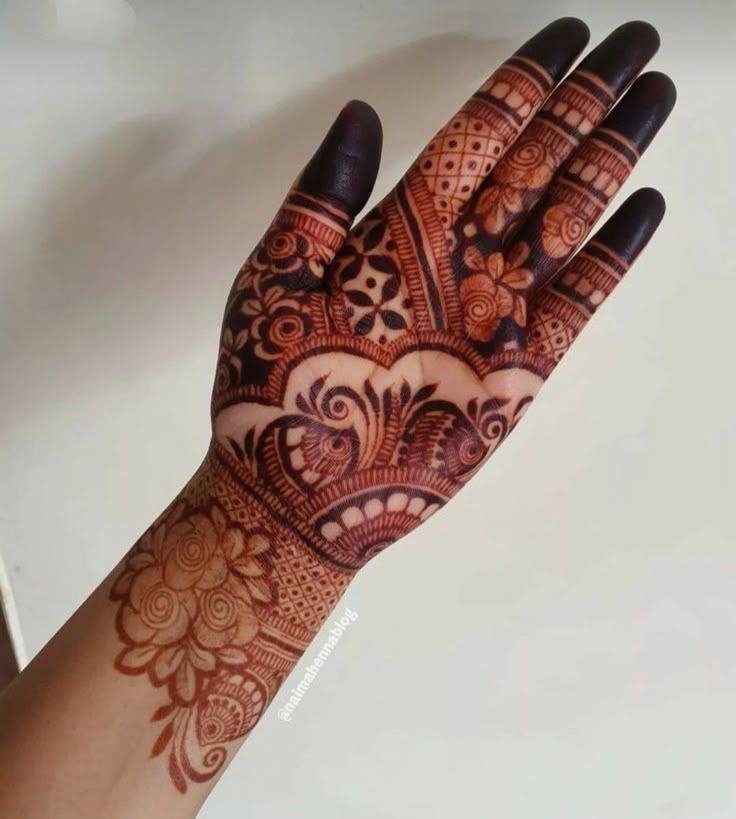 the hand is decorated with intricate designs