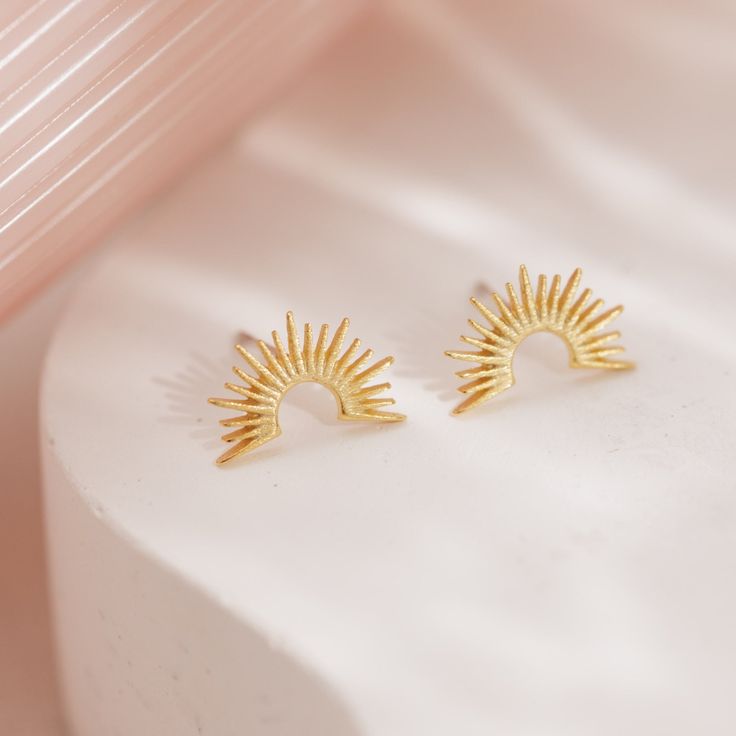 Start your day with a burst of sunshine that will carry you to sunset with our Sunrise Stud Earrings. Meticulously designed, each ray of light catches the eye and deflects light. Pair with our Sunrise Necklace for a sunshine-y style that is modern and sophisticated. Elegant Sunburst Earrings As A Gift, Trendy Gold Sun Design Earrings, Sunburst Earrings As Gift, Sunrise Necklace, Ray Of Light, Its My Birthday, 3 Things, The Eye, Stud Earrings