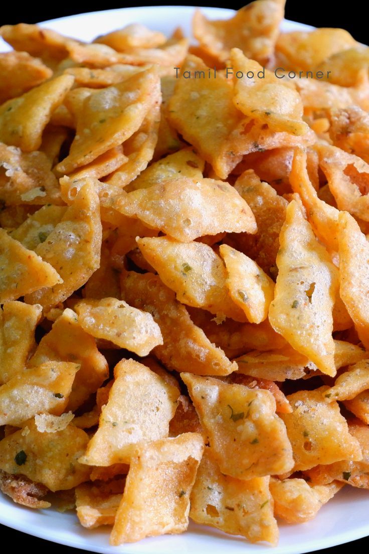 a white plate topped with cheesy crackers