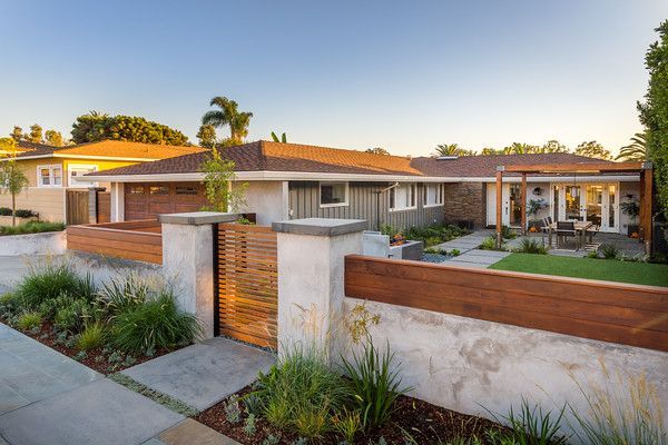 a modern home with landscaping in the front yard