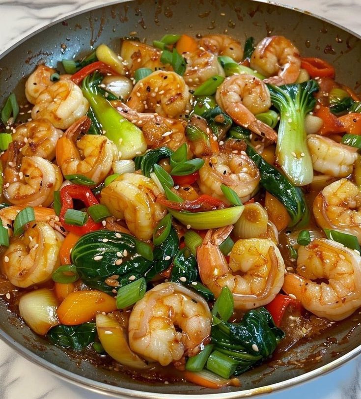 shrimp and vegetable stir fry in a wok