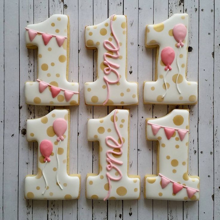 decorated cookies are arranged in the shape of numbers one, two, three and four