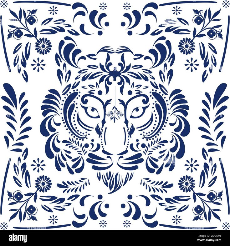 a blue and white ornamental design with an animal's face in the center