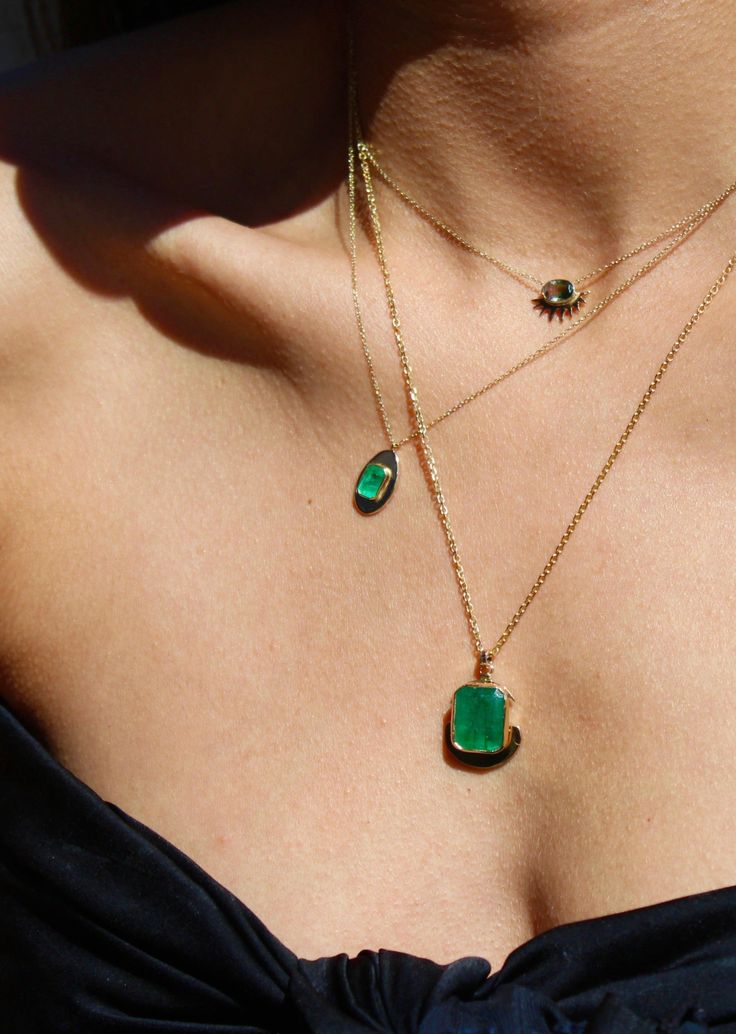 Glowing like a lantern in the night, the firefly pendant features a richly saturated emerald resting on a smooth golden surface. Designed to absorb and reflect light, this delicate yet elegant piece radiates with a quiet energy, gleaming as it rests upon the wearer’s skin Pendant size 10mm x 17mm Necklace length 16", 17" and 18" Made to order | Ships in 3-4 weeks DESIGNED & HANDCRAFTED IN LOS ANGELES, CALIFORNIA Polished Green Jewelry For Evening, Green Polished Jewelry For Evening, Green Polished Evening Jewelry, Green Polished Finish Evening Jewelry, Timeless Green Jewelry For Evening, Timeless Green Evening Jewelry, Luxury Green Emerald Oval Pendant Necklace, Green Gemstone Necklace For Evening, Timeless Green Emerald Necklace As A Gift