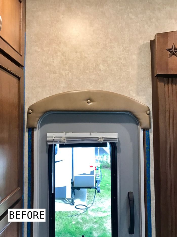 an open door leading to a bathroom in a motor home