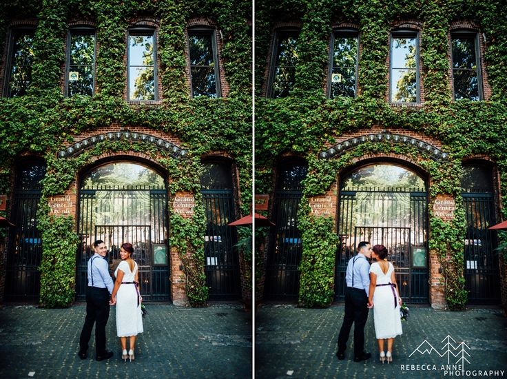 a couple standing in front of an ivy covered building