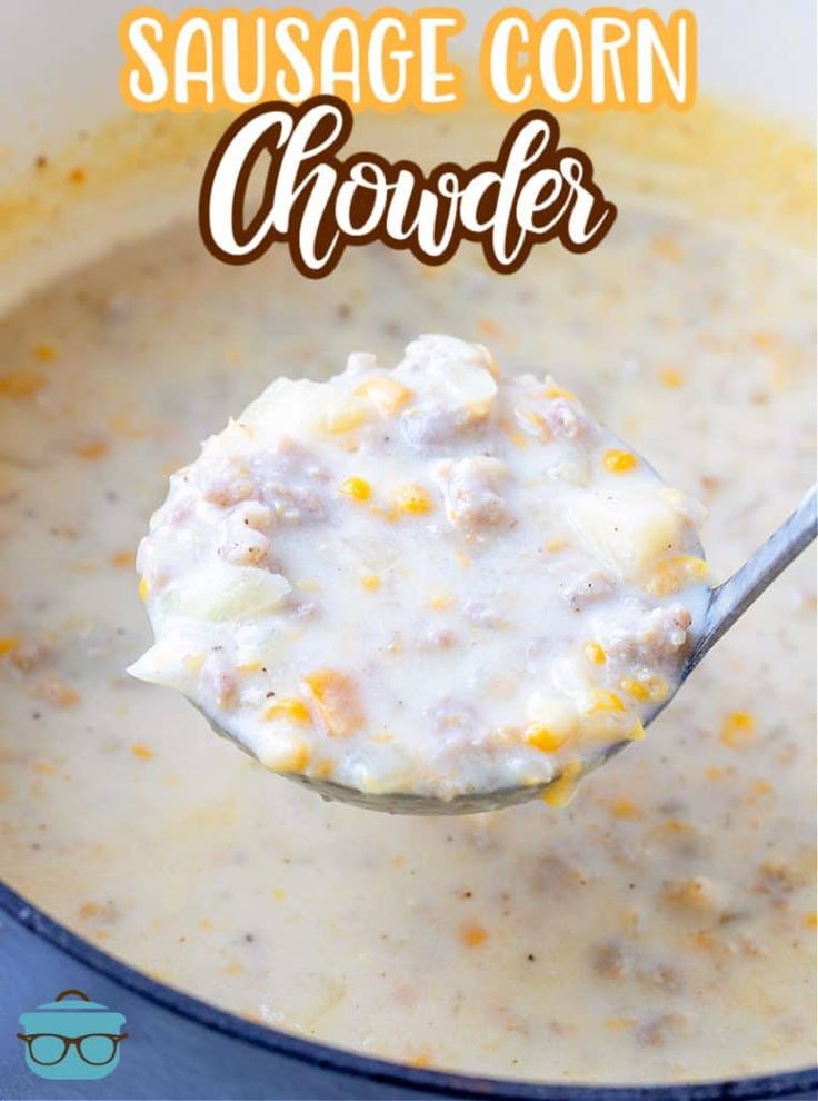 sausage corn chowder in a blue bowl with a spoon