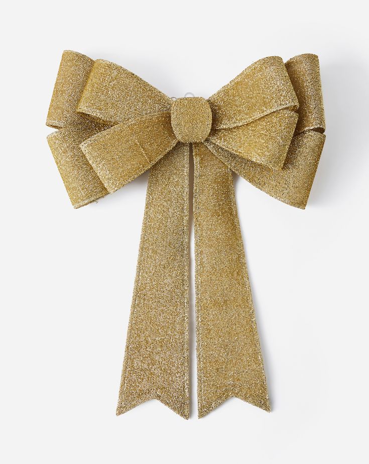 a gold bow on a white background