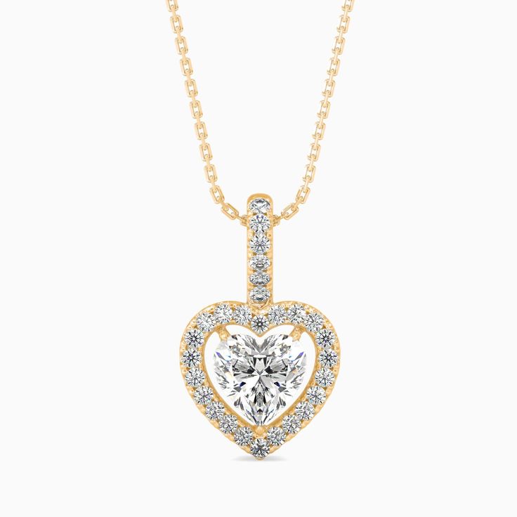 1 CTW Heart Cut Halo Diamond Solitaire Pendant Necklace, IGI Certified Lab Grown Diamond , 0.25-1.50 CTW , 14k Solid Gold Jewelry Elevate any look with this stunning IGI Certified Heart Cut Lab Grown Diamond Solitaire Pendant Necklace, available in 0.25 to 1.50 CTW. Crafted in 14k solid gold, this elegant pendant features a brilliant emerald-cut lab-grown diamond, offering a modern and luxurious twist on the classic solitaire design. Perfect as a birthday gift, this necklace brings together timeless beauty and sustainability, making it a thoughtful and elegant choice for someone special. 𝐅𝐄𝐀𝐓𝐔𝐑𝐄𝐒 * Made to Order * Customizable * Gold - 14K Solid Gold (Yellow Gold, Rose Gold, White Gold) * Total CTW - 1.16 * Setting Type - Prong * Ready To Ship - 12-15 Business Days 𝐌𝐀𝐈𝐍 𝐃𝐈𝐀? Classic Heart Cut Halo Jewelry, Classic Heart Cut Jewelry With Halo Design, Dazzling Yellow Gold Heart Cut Jewelry, Dazzling Heart Cut Yellow Gold Jewelry, Yellow Gold Heart Cut Dazzling Jewelry, Yellow Gold Diamond Necklace With Halo Setting For Anniversary, Anniversary Yellow Gold Diamond Necklace With Halo Setting, Classic Yellow Gold Heart Necklace, Formal Yellow Gold Heart Necklace With Cubic Zirconia