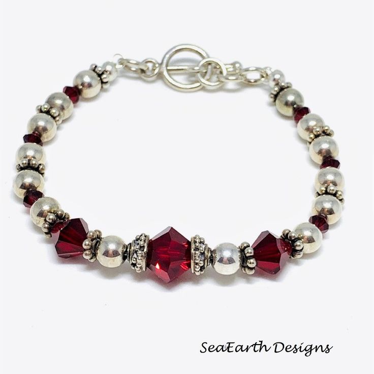 This Bracelet Is Made With Swarovski Crystals, Sterling Silver Ball Beads, Sterling Silver Bali Beads, Sterling Silver Toggle Clasp And It Is 7" In Length. Adjustable Silver Jewelry For Holiday, Adjustable Silver Holiday Jewelry, Elegant Nickel-free Jewelry For Holiday, Red Beaded Jewelry For Anniversary, Silver Jewelry With Round Beads For Holidays, Elegant Adjustable Beaded Bracelets For Christmas, Adjustable Red Sterling Silver Beaded Bracelets, Red Adjustable Sterling Silver Beaded Bracelets, Elegant Red Jewelry With Spacer Beads