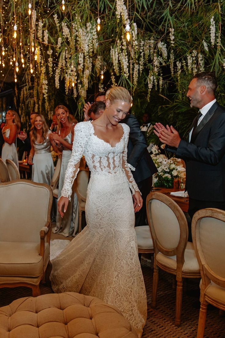 the bride and groom are walking down the aisle