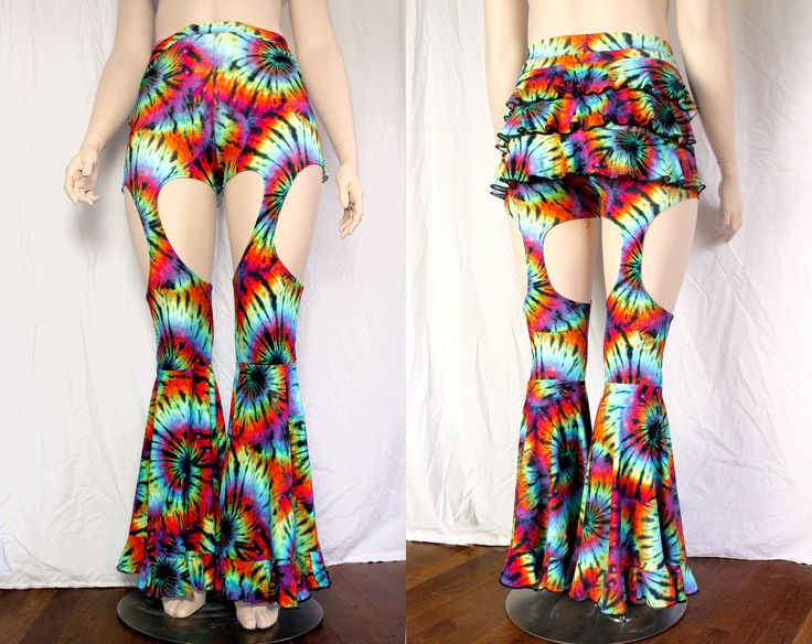 "These pants have everything: - high waist (rise measurement depends on size) - 3 layer ruffle butt - garter style legs - large circle flares - with more ruffles! Matching top coming soon! These are available in our select prints: Blue Galaxy, Fineapple, Neon Chevron (UV reactive), Rainbow Mermaid, Rainbow Tie Dye (shown - UV reactive), and Baelien. All are 4 way stretch spandex. These are currently available in standard sizing Small - 4X, standard inseam length 32\". See last photo for full siz Fitted Hippie Flares For Summer, Stretch High-waisted Flares For Summer, Hippie Flare Stretch Bottoms, Fitted Flares For Spring Festival, Stretch Full-length Ruffled Bottoms, Stretch Full Length Pants With Ruffles, Stretch Full-length Ruffled Pants, Fitted High Waist Summer Flares, Groovy Summer Festival Bottoms