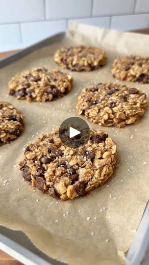 chocolate chip oatmeal cookies on a baking sheet