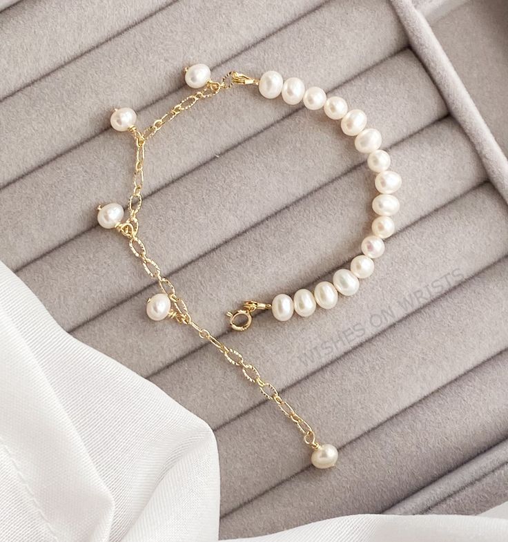 "The bracelet has half fresh water pearls (4-5mm) and half 14k gold plated chain with dangle pearls. Adjustable length. Delicate Pearl Bracelet. Perfect for Everyday Wear A wonderful gift for yourself or someone special. ❖ The pearls are natural, each piece is unique and beautiful so please expect slight variations in color, texture, and size. ❖ The bracelet is made to order, as the bracelet length must be based on your wrist size. The one in the picture is approximately 6.5 inches long and 1.5 Chain Bracelet Ideas, Homemade Pearl Bracelet, Elegant Charm Bracelet With Adjustable Chain And Round Beads, Elegant Charm Bracelet With Pearl And Round Beads, Elegant Bracelets With Adjustable Chain, Elegant Gold Dangle Pearl Bracelet, Dainty Gold Plated Pearl Bracelet With Adjustable Chain, Dainty Gold-plated Pearl Bracelet With Adjustable Chain, Dainty Gold Pearl Charm Bracelet