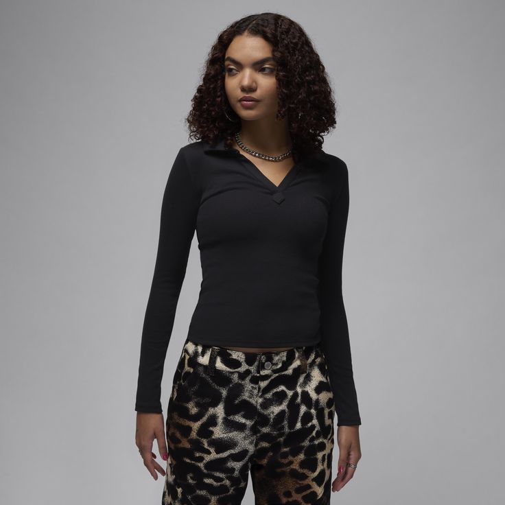 Soft, stretchy and oh-so comfortable. Made for everyday wear, this ribbed long-sleeve top gives you a confident, casual look with a body-skimming fit and V-neck design. Black Ribbed Long Sleeve Top For Winter, Winter Long Sleeve Elastane Top, High Stretch Casual Long Sleeve Top For Layering, Black Tops With Ribbed Cuffs, Trendy Winter Tops In Elastane, Trendy Elastane Long Sleeve Top For Fall, Trendy Fall Long Sleeve Top In Elastane, Black Long Sleeve Top For Fall, Versatile Long Sleeve Ribbed Top