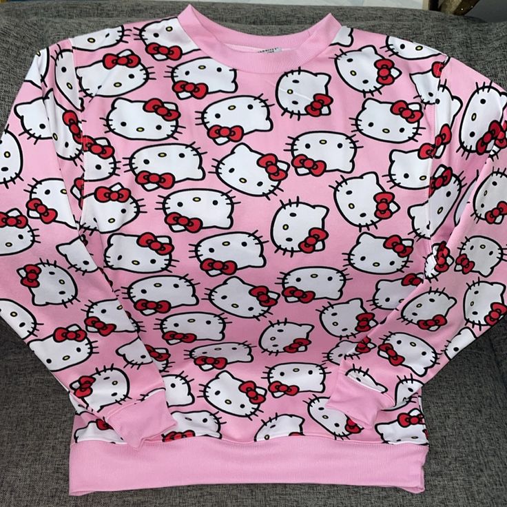 Brand New With Tags Adorable Pink Hello Kitty Pull Over Sweatshirt Kitty Head Aop 100% Polyester S-Xl Available Same/Next Day Shipping Cute Long Sleeve Sweatshirt With Cat Print, Hello Kitty Crew Neck Fun Tops, Hello Kitty Fun Crew Neck Top, Casual Pink Sweatshirt With Cartoon Print, Casual Crew Neck Sweatshirt With Cat Print, Casual Long Sleeve Top With Cat Print, Hello Kitty Cotton Sweatshirt In Kawaii Style, Cute Cotton Sweatshirt With Hello Kitty Print, Kawaii Hello Kitty Print Crew Neck Top