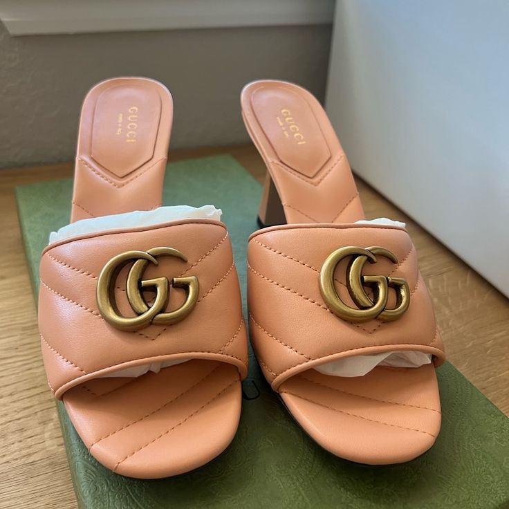 This Is An Authentic Pair Of Gucci Nappa Matelasse Gg Marmont 75mm Slide Sandals 37 In Box Pink. These Heels Are Crafted Of Leather In Pink. They Feature An Antique Gold Gg Logo, A Peep Toe, And A 3.25-Inch Block Heel. Gg Logo, Gg Marmont, Logo A, Gucci Shoes, Slide Sandals, Antique Gold, Women's Shoes Sandals, Block Heels, Shoes Sandals