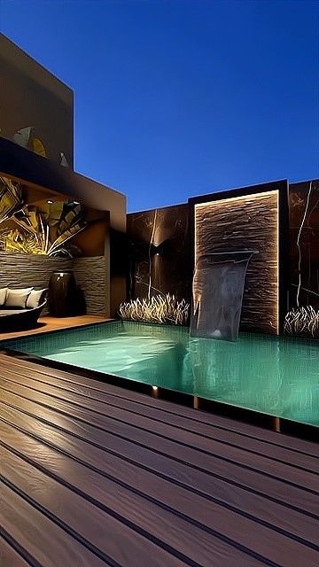 an outdoor swimming pool with water features and lights on the walls, along with wooden decking