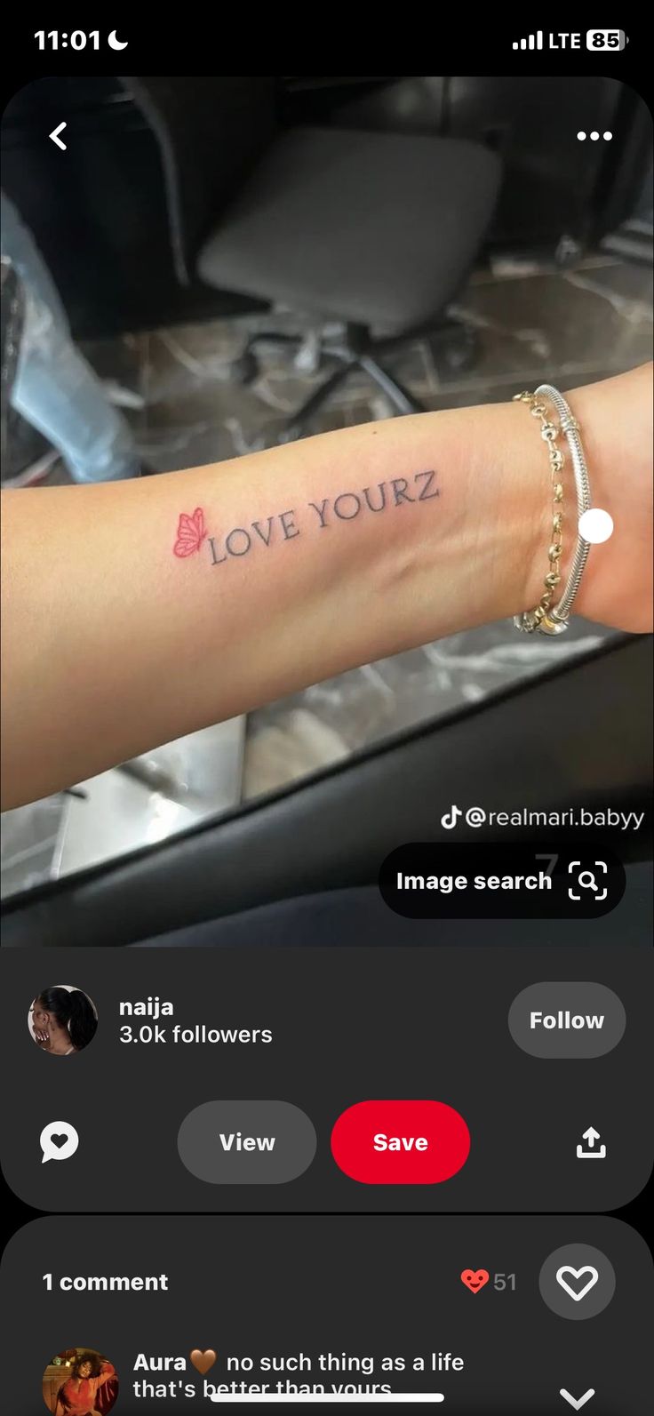 someone has tattooed their arm with the words love yourz on it and an arrow