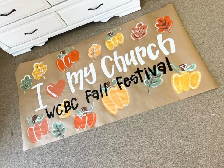 a sign that says i love my church, webc fall festival on the floor