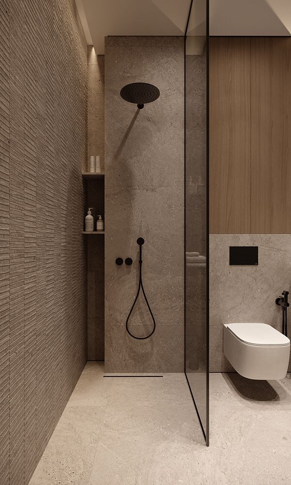 a bathroom with a shower, toilet and sink in it's center wall is shown