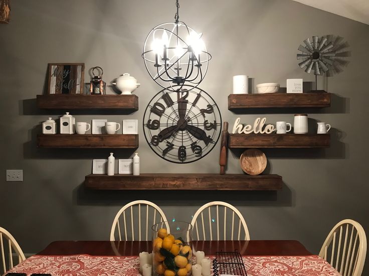 the dining room table is set with plates, cups and utensils on it