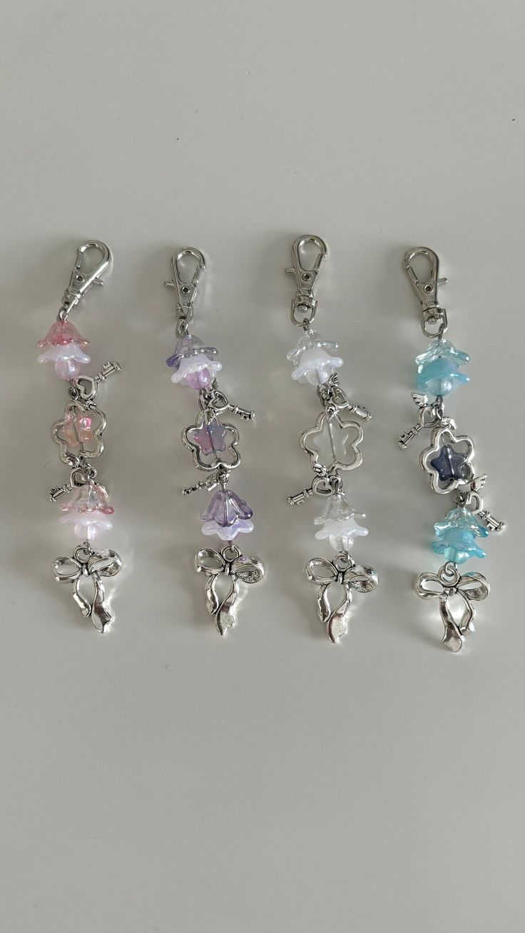 six charms with different colors and shapes