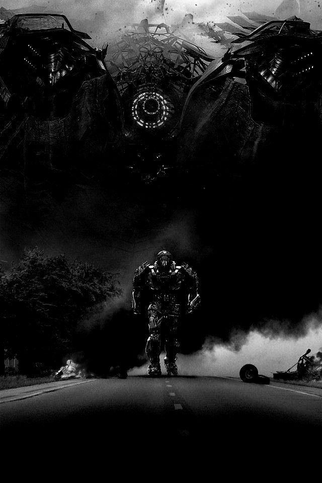 a black and white photo of a man standing in the middle of a road surrounded by monsters