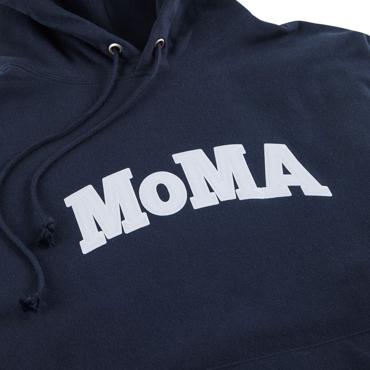 MoMA Exclusive: Champion first produced this hoodie sweatshirt in the 1930s to keep athletes warm during training. Our version has �MoMA� appliqu�d in classic college-style lettering. The MoMA Champion Hoodie was first produced in connection with MoMA's 2017 exhibition Items: Is Fashion Modern? An original version of the Champion Hoodie from the 1980s is an object in MoMA's collection. Collegiate Logo Print Hoodie Sweatshirt, Collegiate Hoodie Sweatshirt With Logo Print, Collegiate Style Hoodie Sweatshirt With Logo Print, Varsity Cotton Hoodie With Embroidered Logo, Classic Letter Print Sweatshirt For Streetwear, Navy Sporty Hoodie With Embroidered Logo, Athleisure Hoodie With Logo Print For College, Navy Hoodie Sweatshirt With Embroidered Logo, Collegiate Letter Patch Sweatshirt For Streetwear