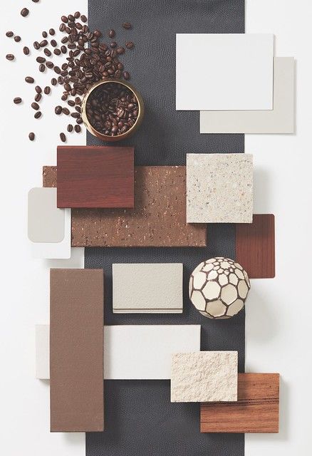 an assortment of different types of tiles and materials on a table with coffee beans in a bowl