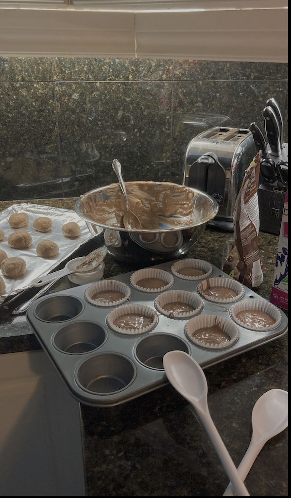 there are many muffins on the counter ready to be baked in the oven