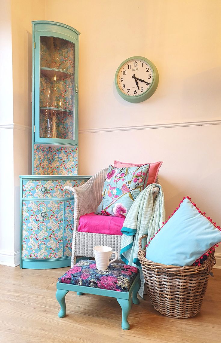 a living room filled with furniture and a clock on the wall