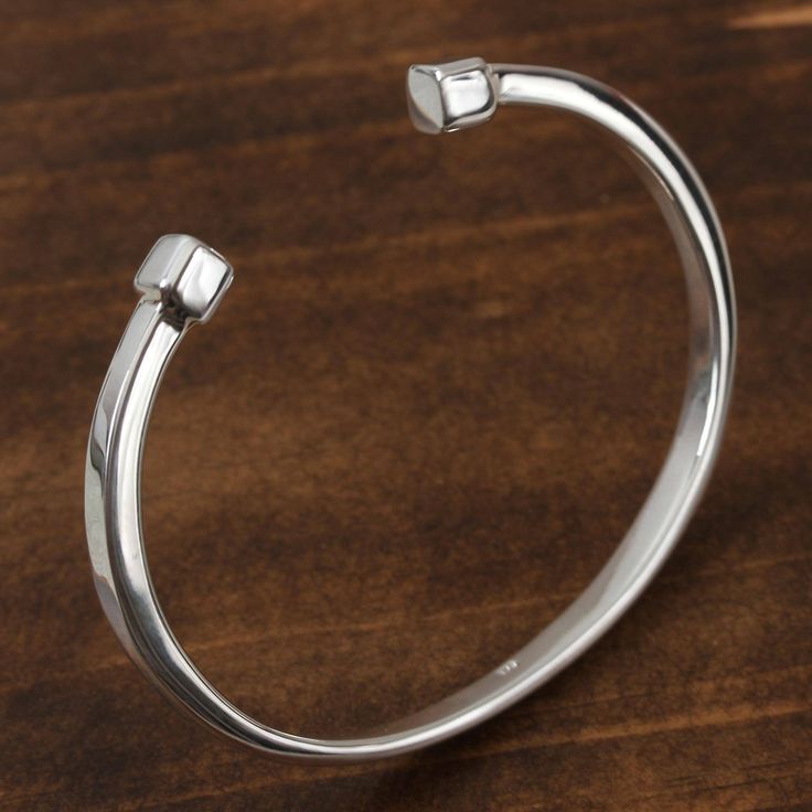 Crafted from sterling silver with a high-polish finish this cuff bracelet is designed by Mexican duo Graeme and Philip Watson. This accessory will bring the beauty of Taxco silversmithing to your wardrobe. Sterling Silver Open Band Bangle As Gift, Sterling Silver Open Cuff Bracelets With Polished Finish, Sterling Silver Open Cuff Bracelet With Polished Finish, Polished Sterling Silver Open Cuff Bracelet, Classic Sterling Silver Open Band Bracelet, White Gold Polished Sterling Silver Cuff Bracelet, Sterling Silver Polished Cuff Bracelet, Sterling Silver Cuff Bracelet With Polished Finish, Sterling Silver Open Cuff Bangle For Gift