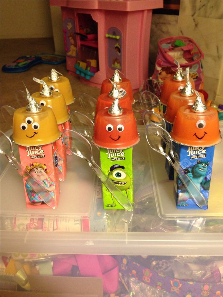 there are many different colored toothbrushes in the box with faces on each one