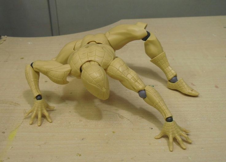 a toy figure is posed on a table