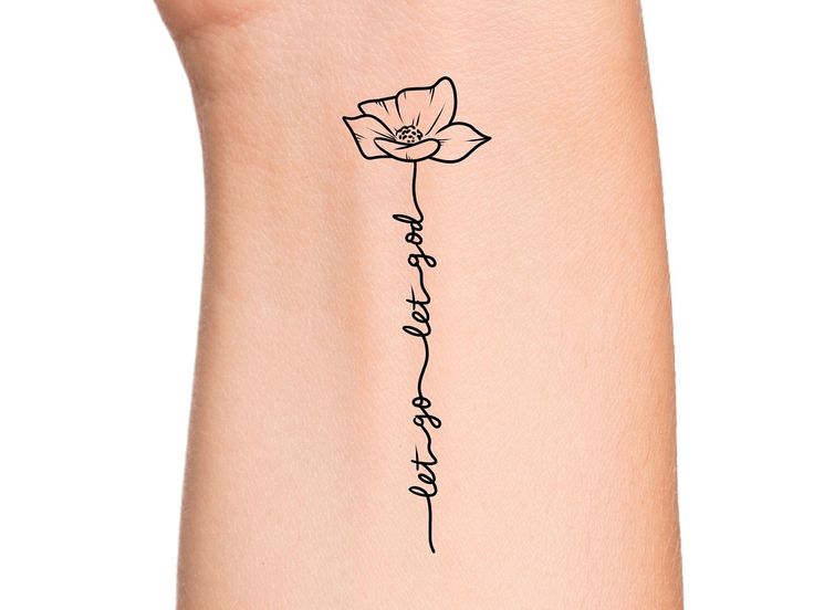 a small tattoo on the side of a woman's leg with words written in cursive writing