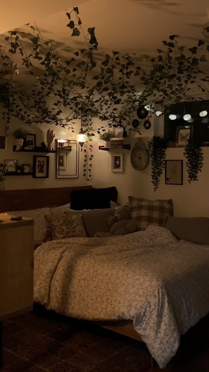 a bed sitting in a bedroom next to a wall with pictures hanging on the walls