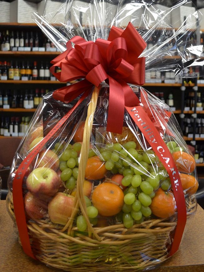 a basket filled with lots of fruit sitting on top of a table