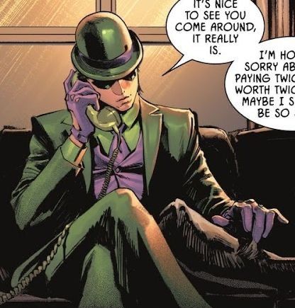 a man in a green suit and top hat talking on a cell phone while sitting next to a window