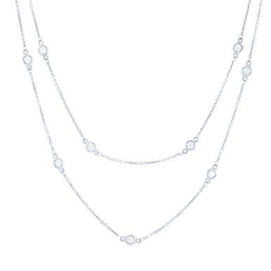 A staple in any jewelry collection this necklace features round brilliant cut diamonds in bezel stations. Elegant Bezel Setting Station Necklace, Elegant Bezel Set Station Necklace, Dazzling Silver Necklace With Bezel Setting, Dazzling Necklace With Bezel Setting And Round Cut, Dazzling Round Cut Necklace With Bezel Setting, Dazzling Diamond-white Diamond Necklace With Bezel Setting, Timeless Diamond White Necklaces With Bezel Setting, Classic Cubic Zirconia Tennis Necklace With Bezel Setting, Cubic Zirconia Diamond Necklace With Bezel Setting