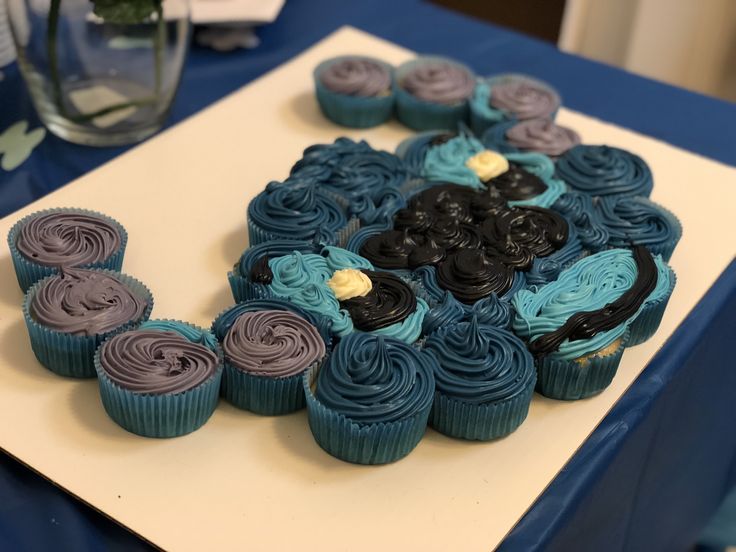 cupcakes are arranged in the shape of a flower