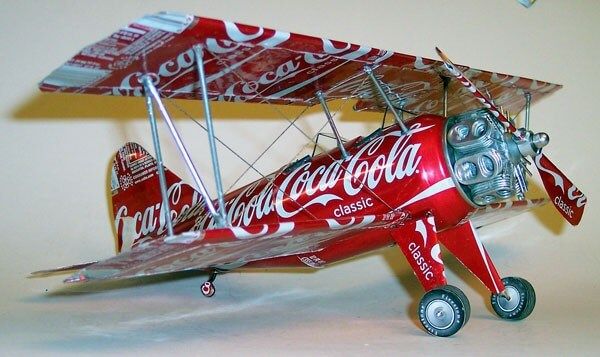 a model airplane with coca cola painted on it