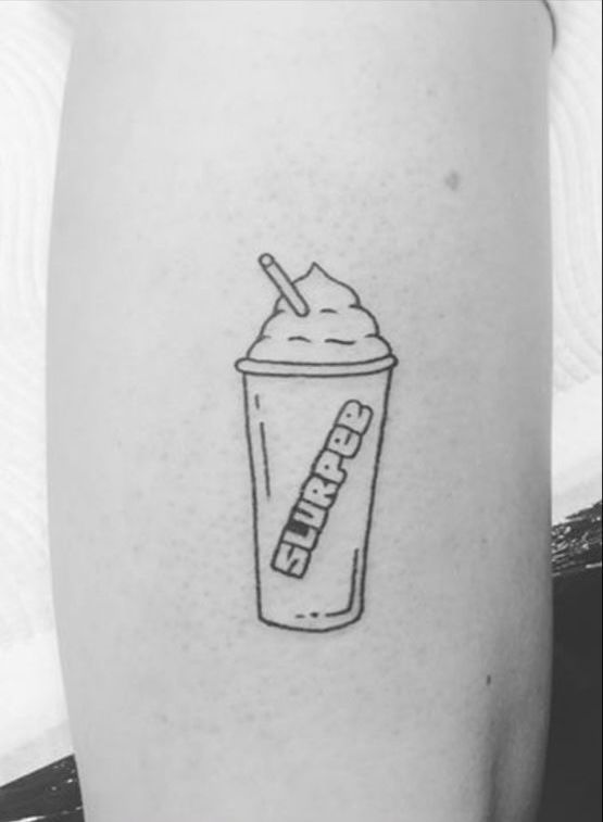 a black and white photo of a starbucks drink with a straw in it's cup