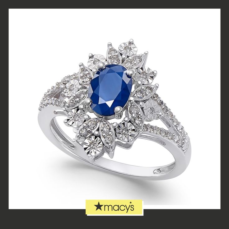 a blue and white diamond ring with diamonds around it