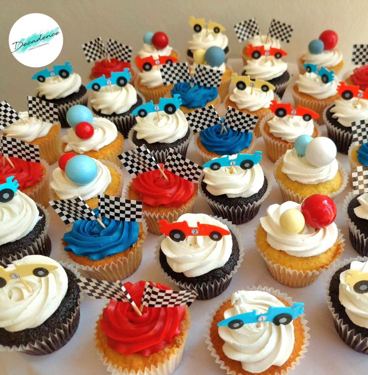 many cupcakes are decorated with racing cars